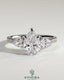 Kynora CJ 2ct pear-shaped diamond trilogy engagement ring with side stones, pave band, and cathedral high setting.
