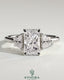 Kynora CJ 2ct radiant claw trilogy engagement ring with trapezoid side stones in a low setting, showcasing elegant diamond design.