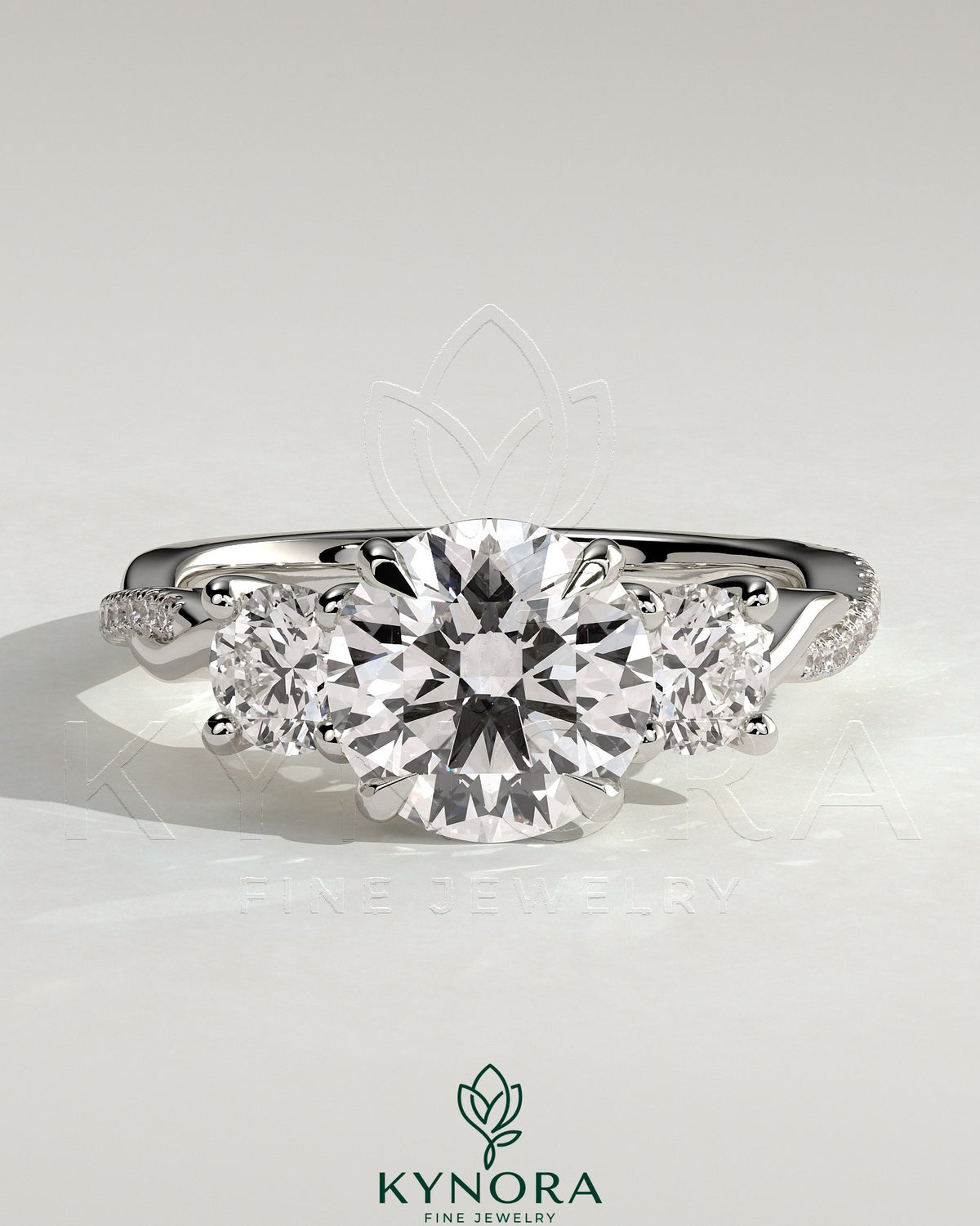 Kynora CJ three stone engagement ring with 2ct round claw trilogy, round side stones, twisted pave band, and trellis gallery design Main image