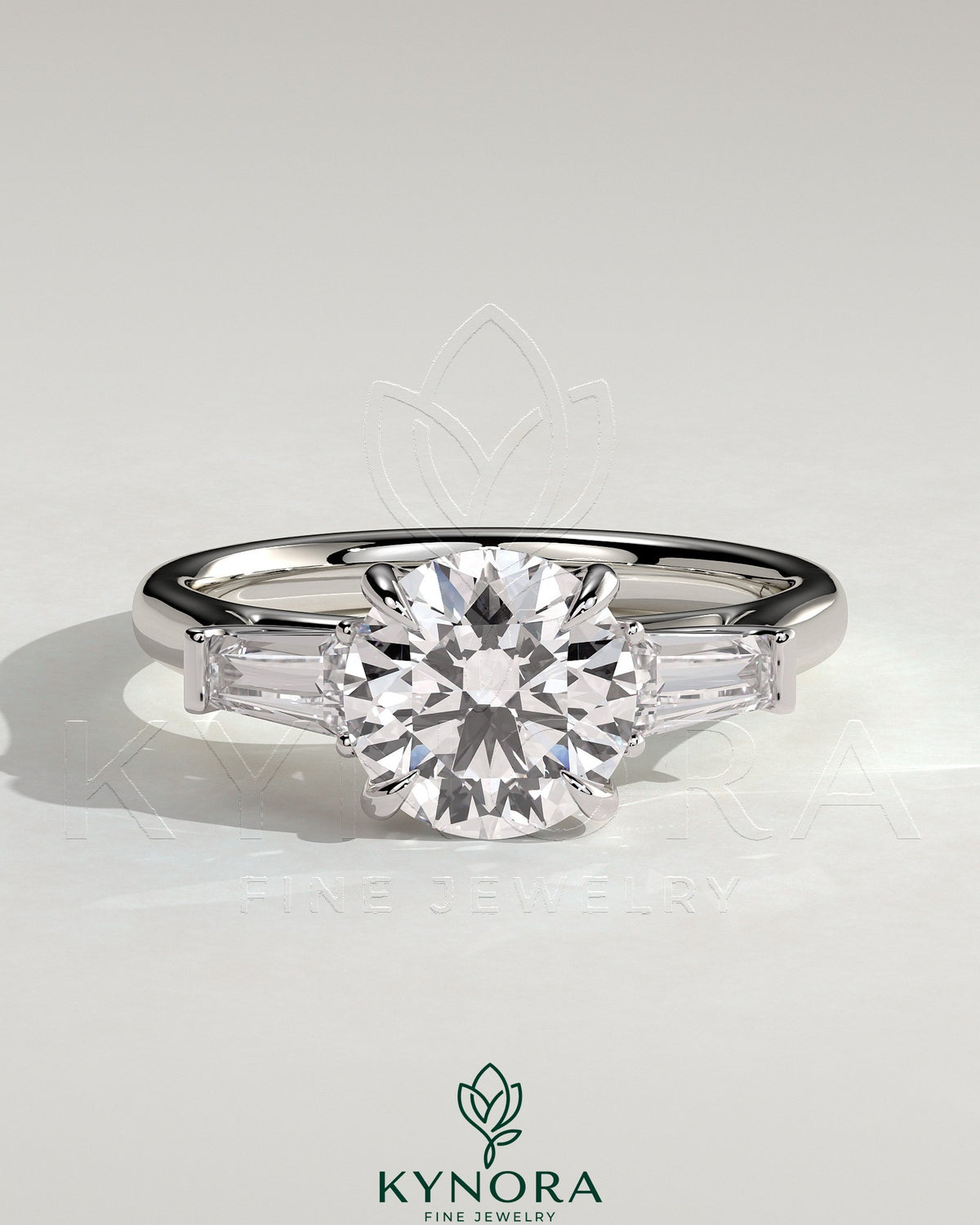 Kynora CJ three-stone engagement ring with 2ct round center diamond, tapered baguette side stones, cathedral setting. Main image