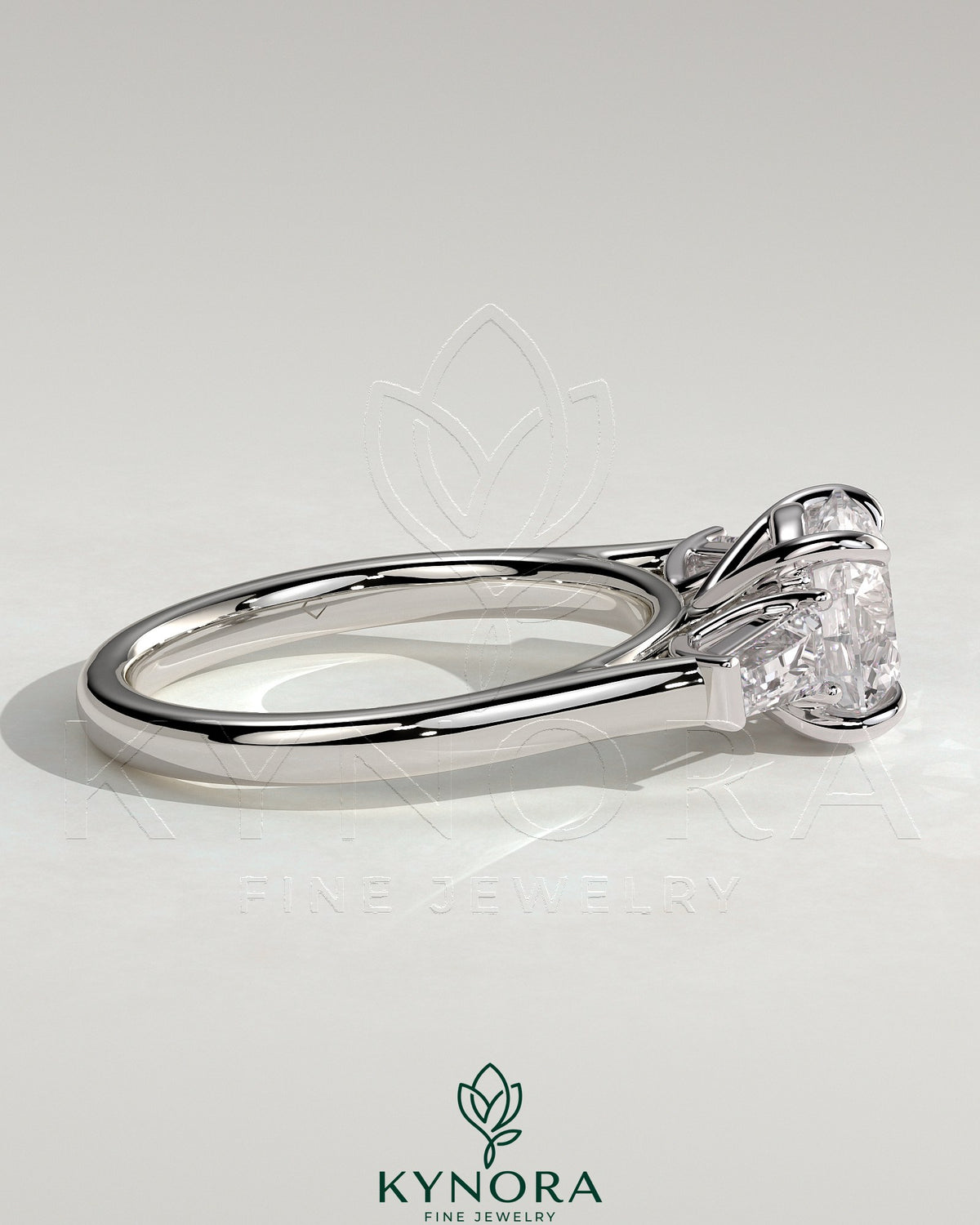 Kynora CJ 2ct round claw trilogy engagement ring with tapered baguette side stones and cathedral setting, showcasing elegant jewelry design.