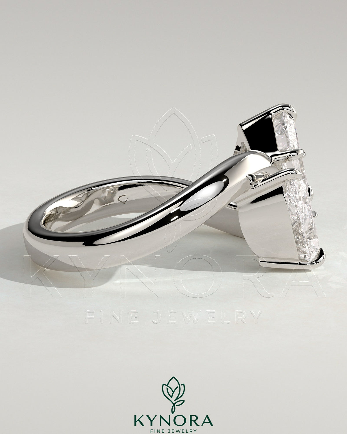 Kynora CJ Claw Toi et Moi engagement ring with wave band featuring two intertwined diamonds on a gold band.