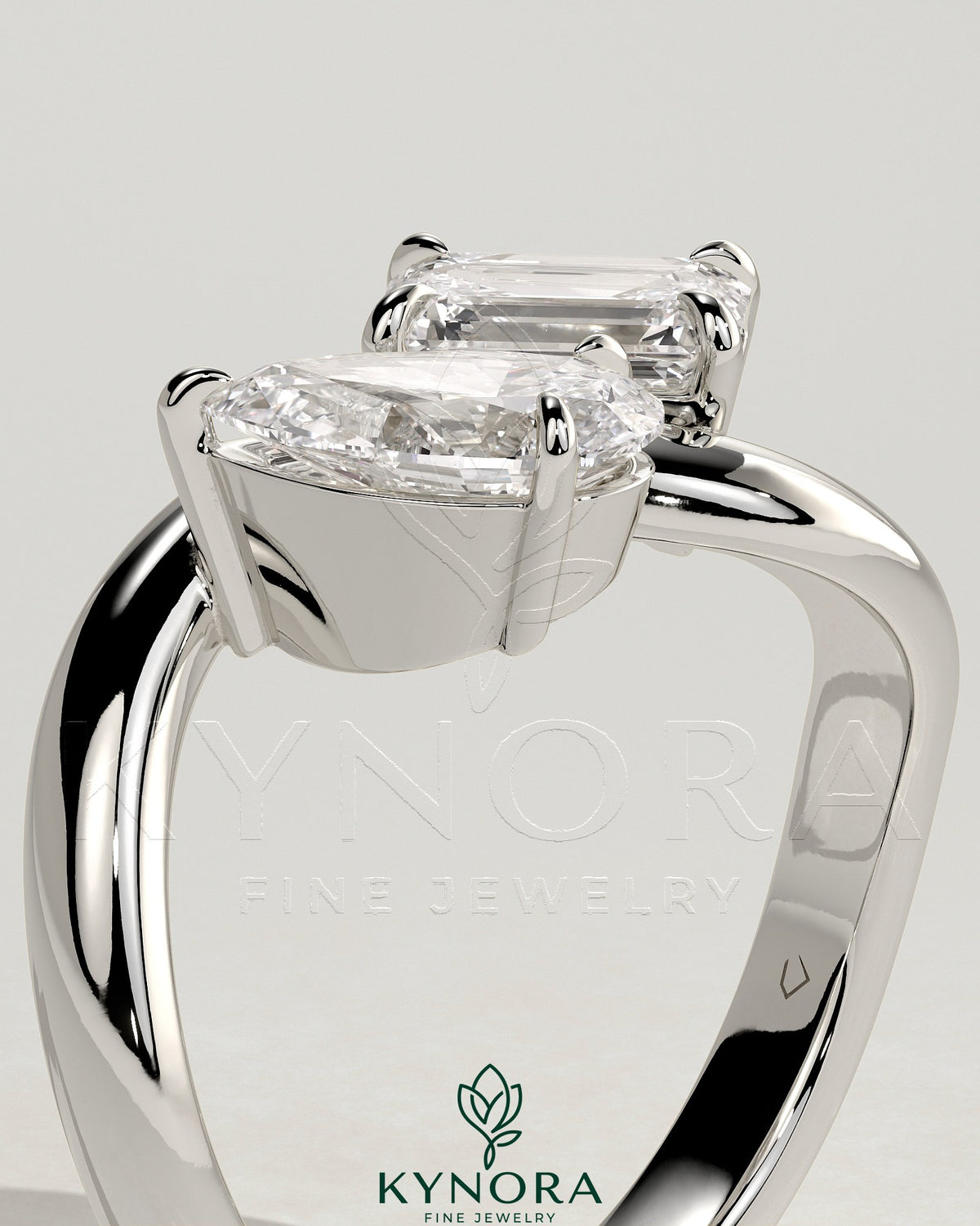 Kynora CJ Claw Toi et Moi engagement ring with wave band featuring two sparkling gemstones in a unique design