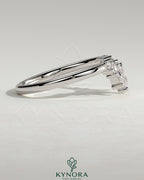 Kynora CJ accent stone wedding band with curved design, featuring a sleek gold band and sparkling accent stones.
