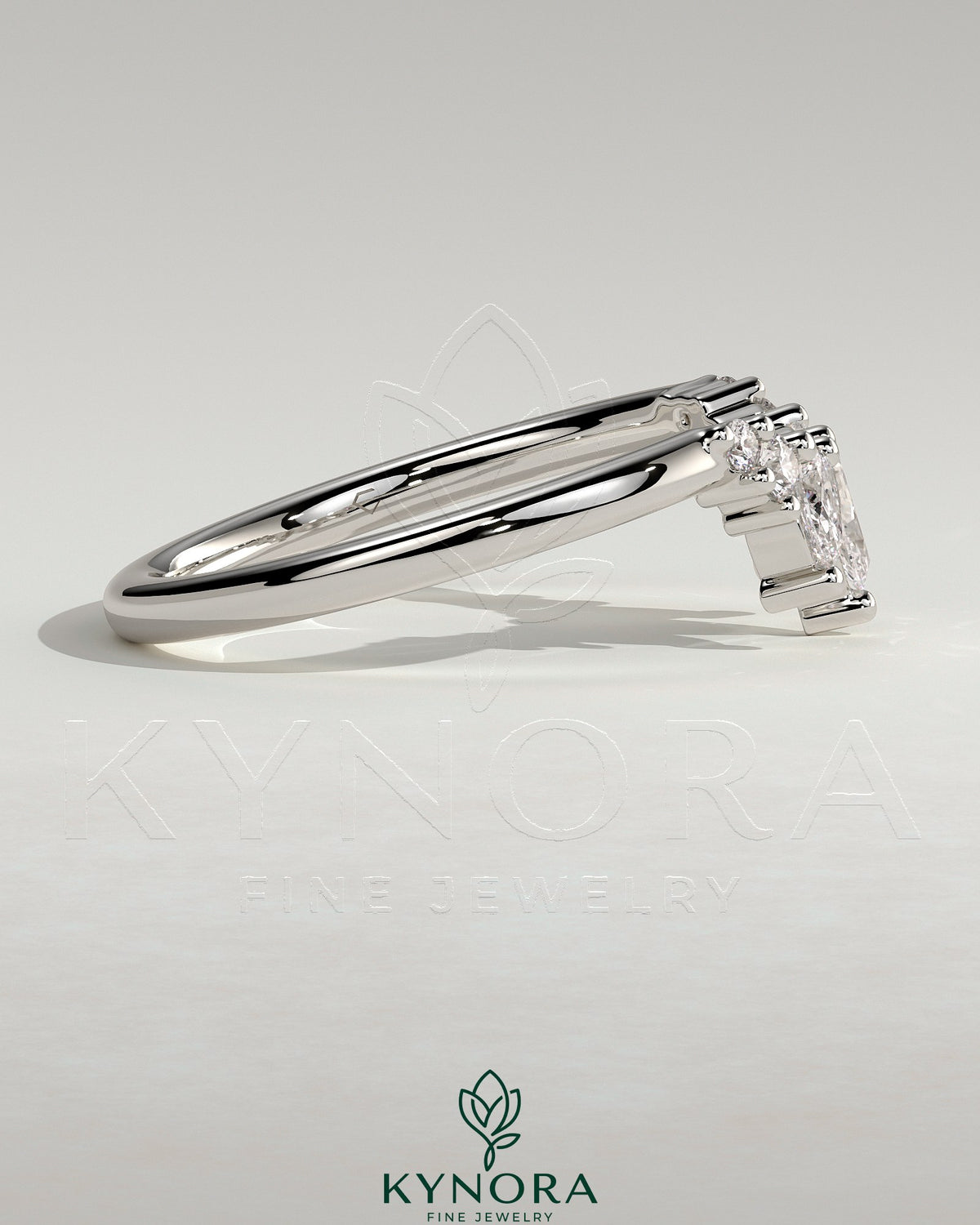 Kynora CJ accent stone wedding band with curved design, featuring a sleek gold band and sparkling accent stones.