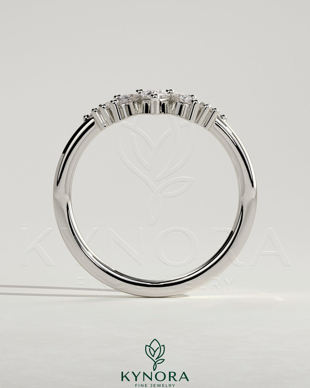 Kynora CJ accent stone wedding band with a curved design, featuring sparkling stones on a sleek gold wedding ring.