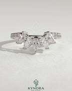 Kynora CJ accent stone wedding band with curved pave design, showcasing sparkling stones and elegant craftsmanship.