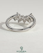 Kynora CJ accent wedding band with curved pave stone design, featuring sparkling gemstones on a sleek gold band.