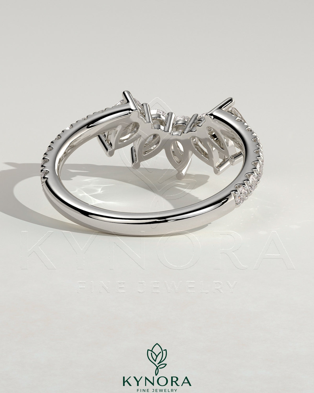 Kynora CJ accent wedding band with curved pave stone design, featuring sparkling gemstones on a sleek gold band.