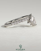 Kynora CJ accent wedding band with curved pave stone design, featuring sparkling gemstones on a sleek gold band.