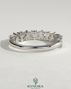 Kynora CJ wedding band featuring angled marquise and round accent stones in a sleek, elegant design.
