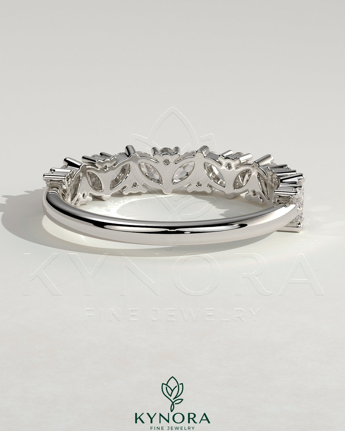 Kynora CJ wedding band featuring angled marquise and round accent stones in a sleek, elegant design.