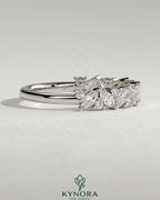Kynora CJ wedding band with angled marquise and round accent stones, elegant gold ring for special occasions