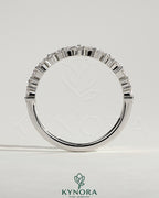 Kynora CJ wedding band with angled marquise and round accent stones, elegant gold wedding ring for special occasions.