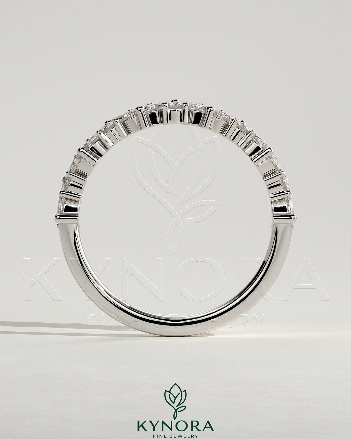 Kynora CJ wedding band with angled marquise and round accent stones, elegant gold wedding ring for special occasions.