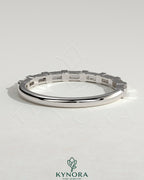 Kynora CJ Baguette Spaced Accent Stone Wedding Ring featuring a sleek band with baguette and accent stones design.