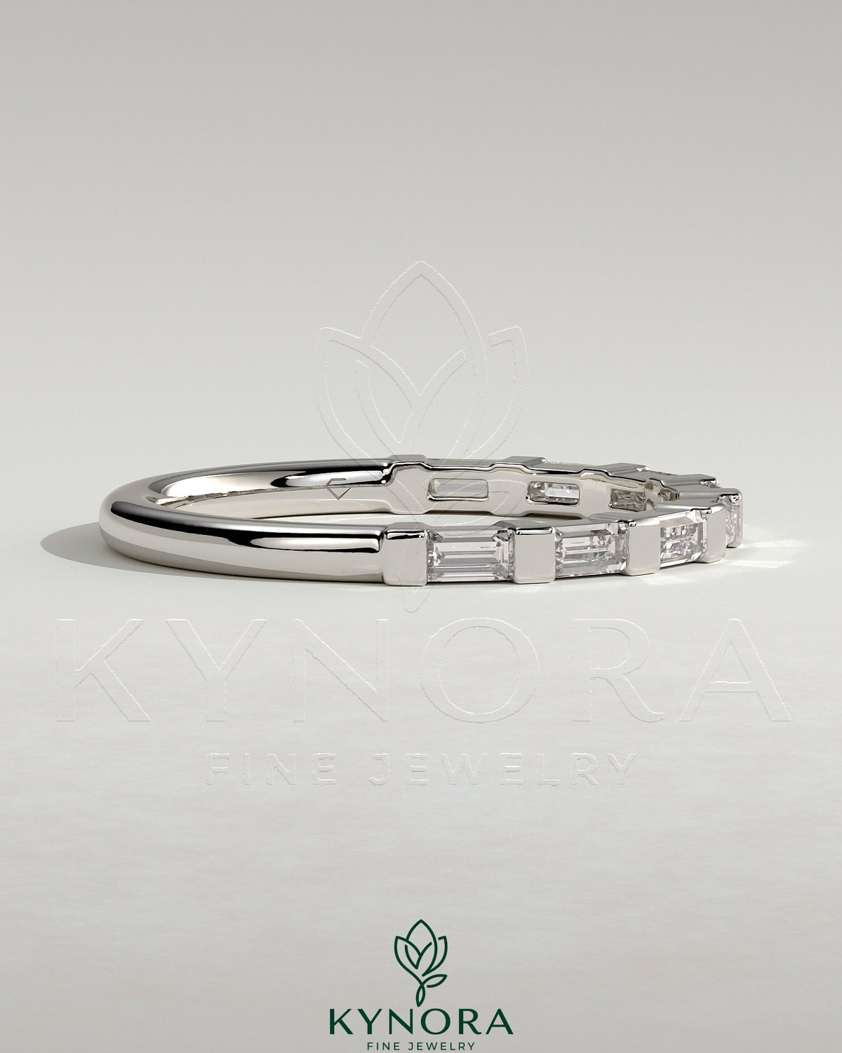 Kynora CJ wedding band featuring a baguette-shaped spaced accent stone design on a sleek gold wedding ring