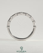 Kynora CJ Baguette Spaced Accent Stone Wedding Band with sleek design and sparkling stones for elegant bridal jewelry.