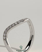 Kynora CJ pave bead wedding band with wave design, featuring sparkling pave beads on a sleek gold band.