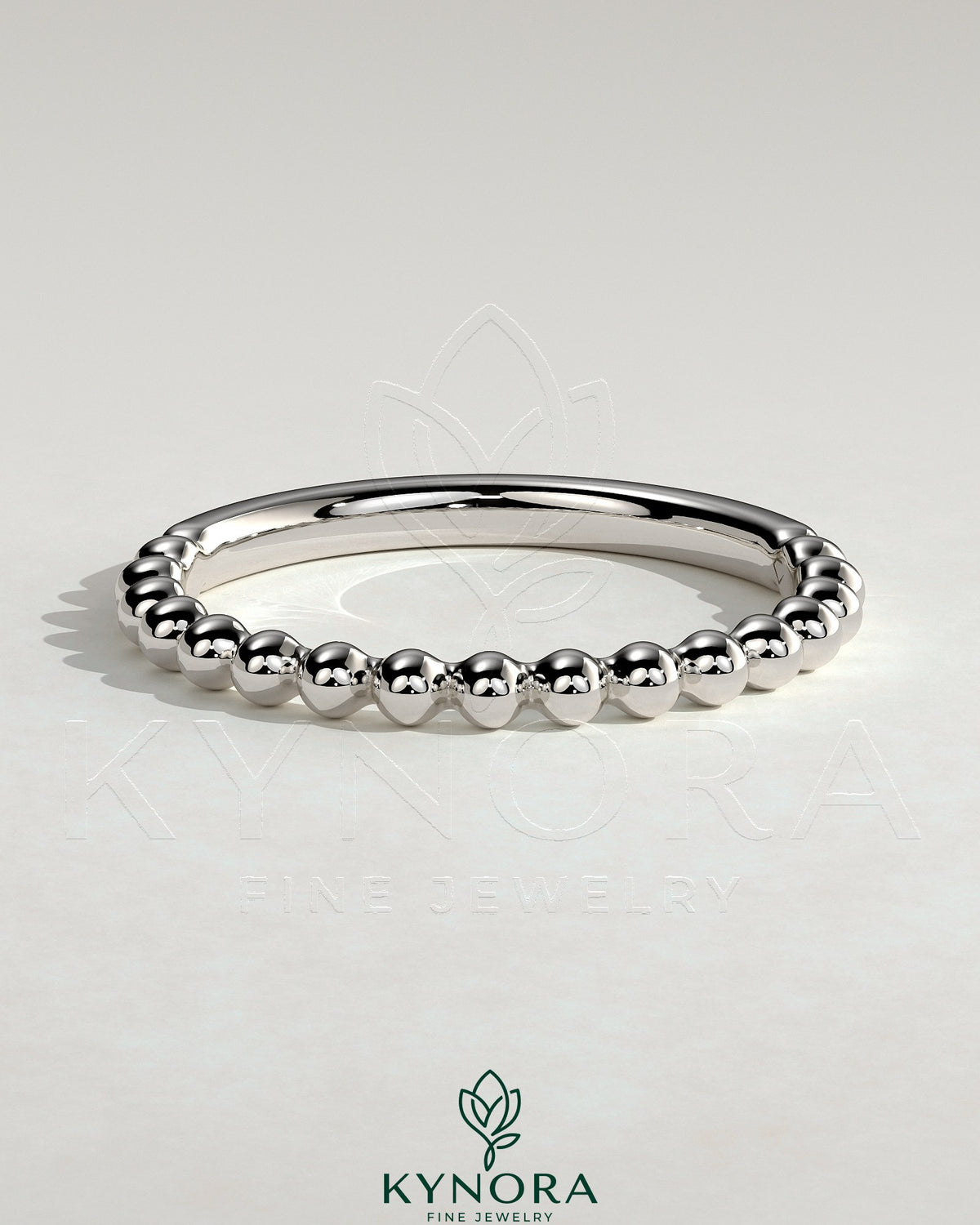 Kynora CJ beaded wedding band ring with intricate bead detailing, designed for elegant bridal jewelry.
