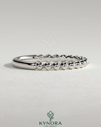 Kynora CJ beaded wedding band ring with intricate beaded design, crafted for elegant wedding jewelry.