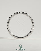 Beaded Kynora CJ wedding band ring with intricate beaded design, elegant and suitable for special occasions.