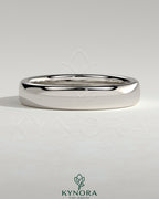 Kynora CJ wedding band with cigar-style design, made of polished metal, suitable for wedding or special occasions