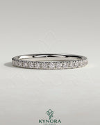 Kynora CJ classic full pave band wedding ring with sparkling diamond accents on polished gold band.