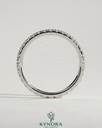 Elegant Kynora CJ full pave band wedding ring with sparkling diamonds, showcasing a classic and timeless design.