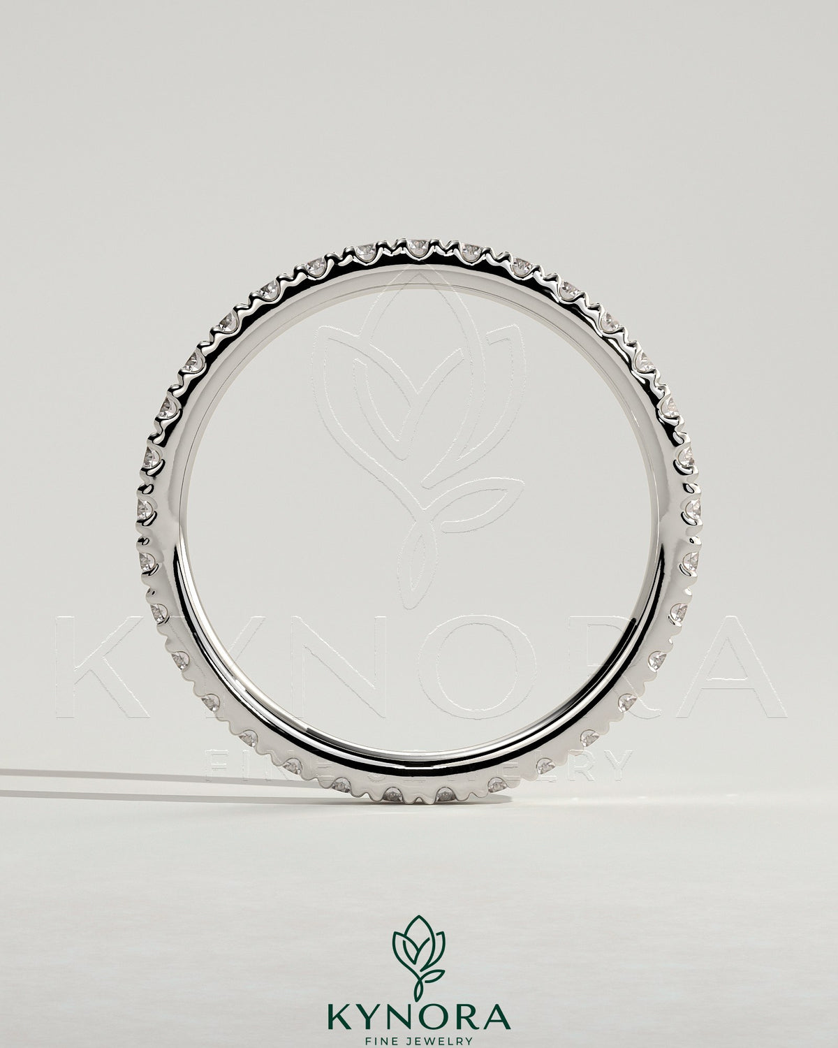 Elegant Kynora CJ full pave band wedding ring with sparkling diamonds, showcasing a classic and timeless design.