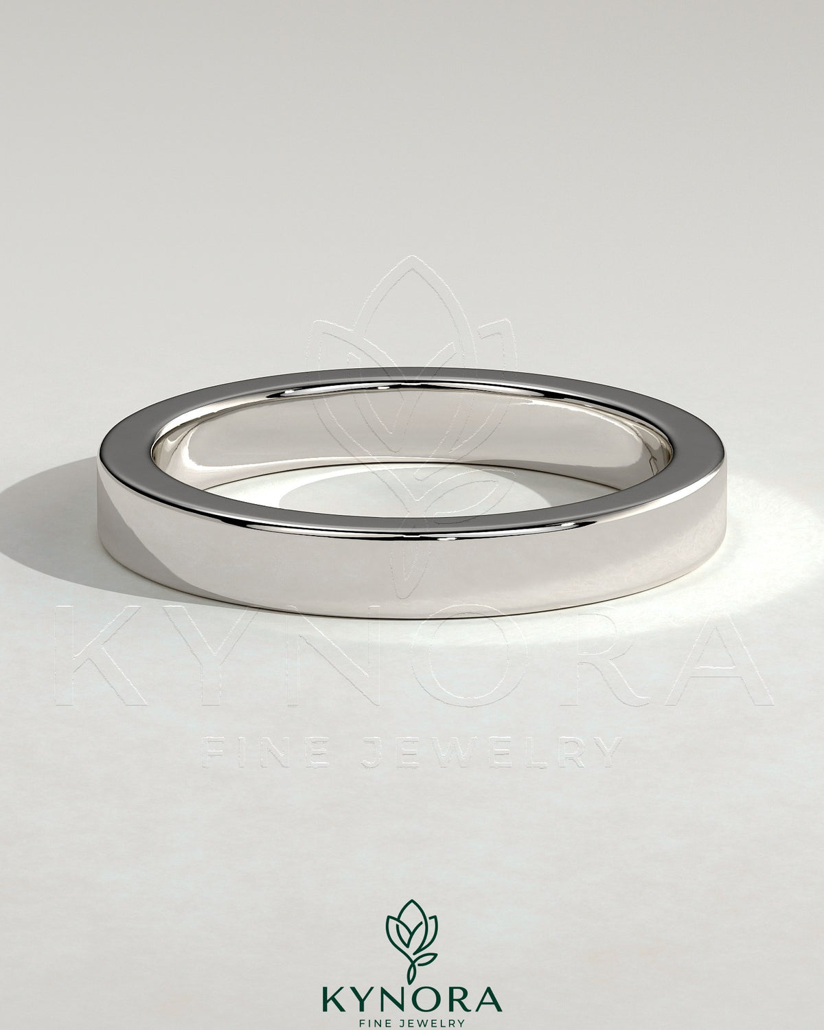 Kynora CJ classic hidden pave flat cigar band wedding ring with subtle sparkling accents on a gold band. Imagen principal del producto