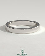 Kynora CJ classic hidden pave flat cigar band wedding ring with intricate diamond detailing on smooth gold band