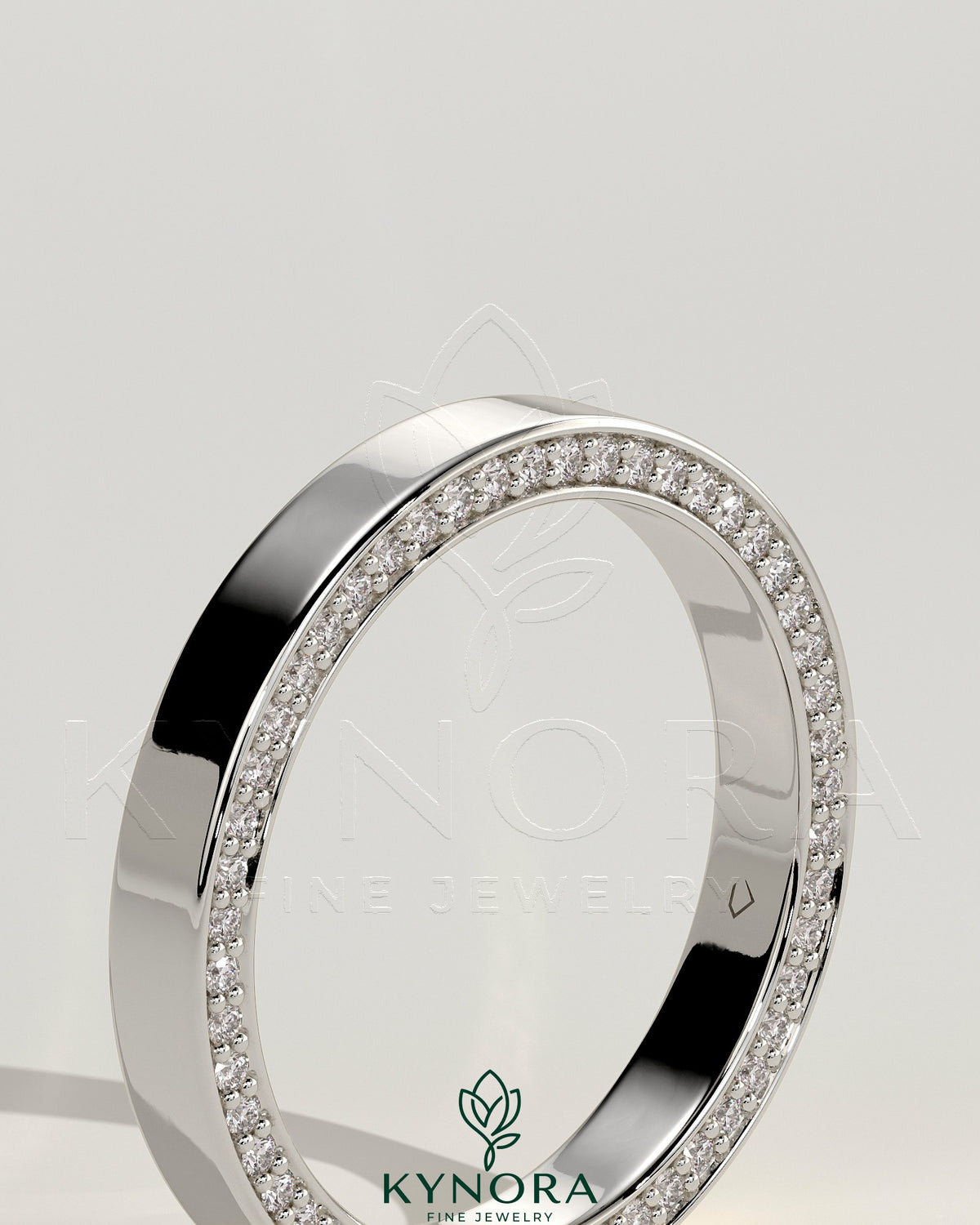 Kynora CJ Classic hidden pave flat cigar band wedding ring with subtle sparkling accents on smooth gold band
