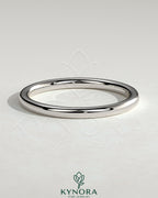Plain gold wedding band by Kynora CJ, showcasing a simple, classic design for wedding or special occasions.