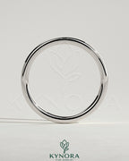 Plain gold wedding band from Kynora CJ, showcasing a classic, smooth design ideal for wedding jewelry.