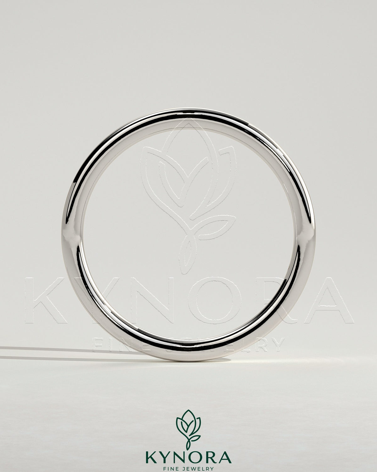 Plain gold wedding band from Kynora CJ, showcasing a classic, smooth design ideal for wedding jewelry.