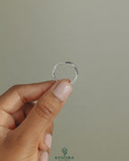 Elegant deep V band wedding ring by Kynora CJ featuring a sleek, modern design in polished metal for wedding jewelry.
