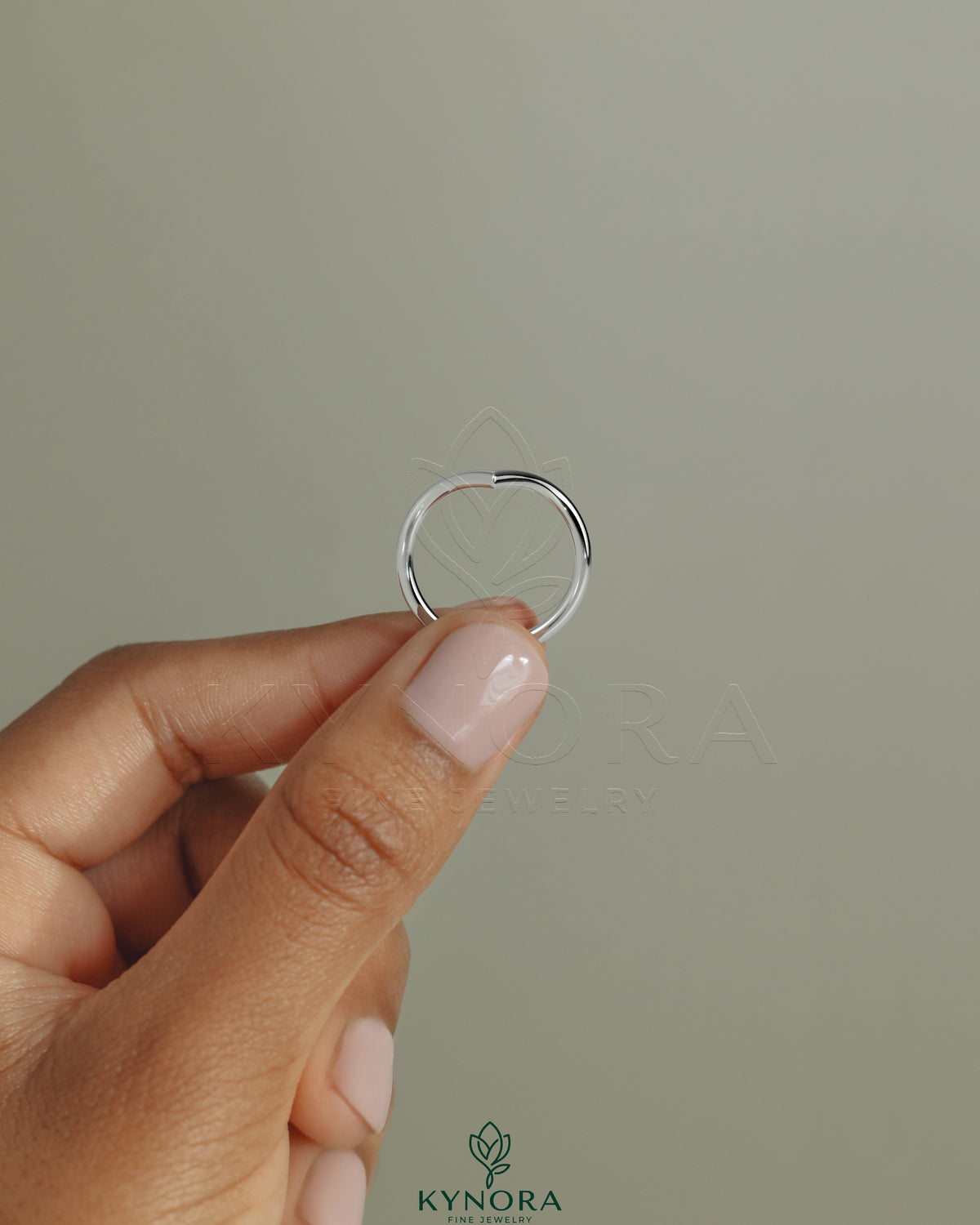 Elegant deep V band wedding ring by Kynora CJ featuring a sleek, modern design in polished metal for wedding jewelry.