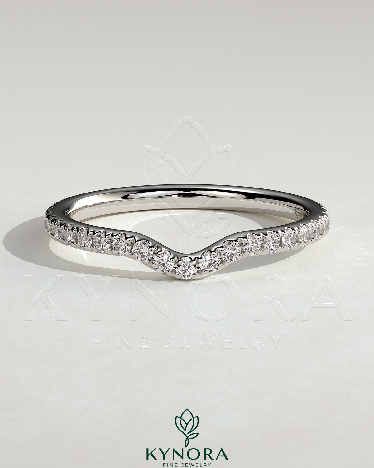Demi two-third curved pave diamond wedding band by Kynora CJ, featuring intricate pave setting and elegant curved design.