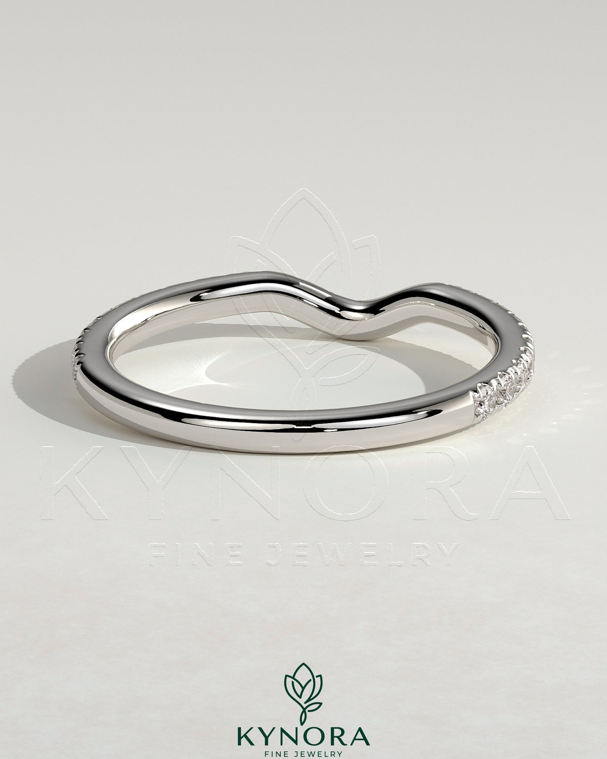 Kynora CJ Demi Two Thirds Curved Pave Band wedding ring showcasing a delicate, curved design with pavé setting of small sparkling stones.