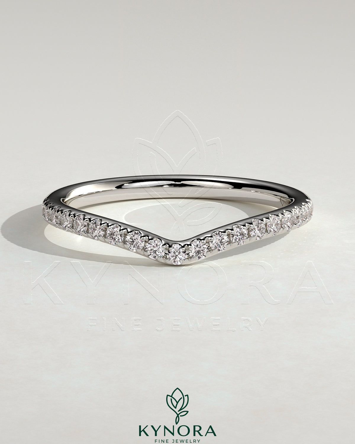 Kynora CJ dipped half pave curved wedding band with sparkling pave accents, showcasing elegant jewelry craftsmanship. Main image