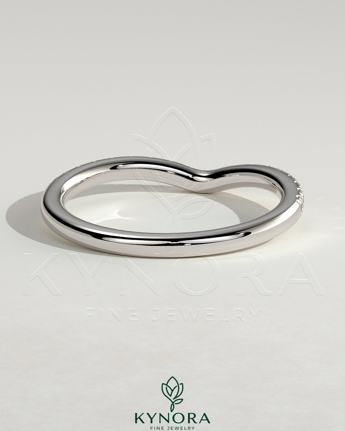 Kynora CJ dipped half pave curved wedding band with small sparkling stones, elegant and stylish jewelry for special occasions.