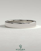 Kynora CJ flat cigar band wedding ring made of polished metal, simple and elegant design for wedding jewelry.