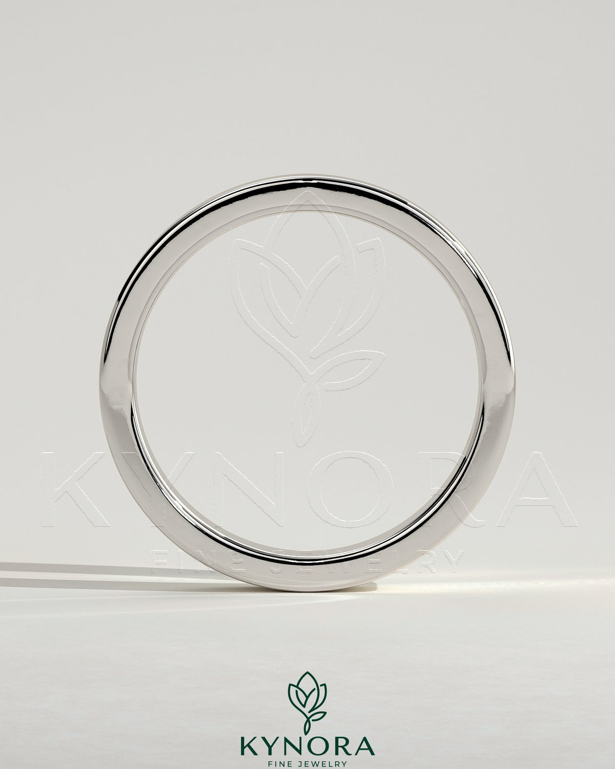 Kynora CJ flat cigar band wedding ring with a smooth, polished gold finish, showcasing a simple and elegant design.