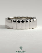 Kynora CJ fluted wedding band with a textured cigar-style design, crafted for elegant wedding or anniversary jewelry.