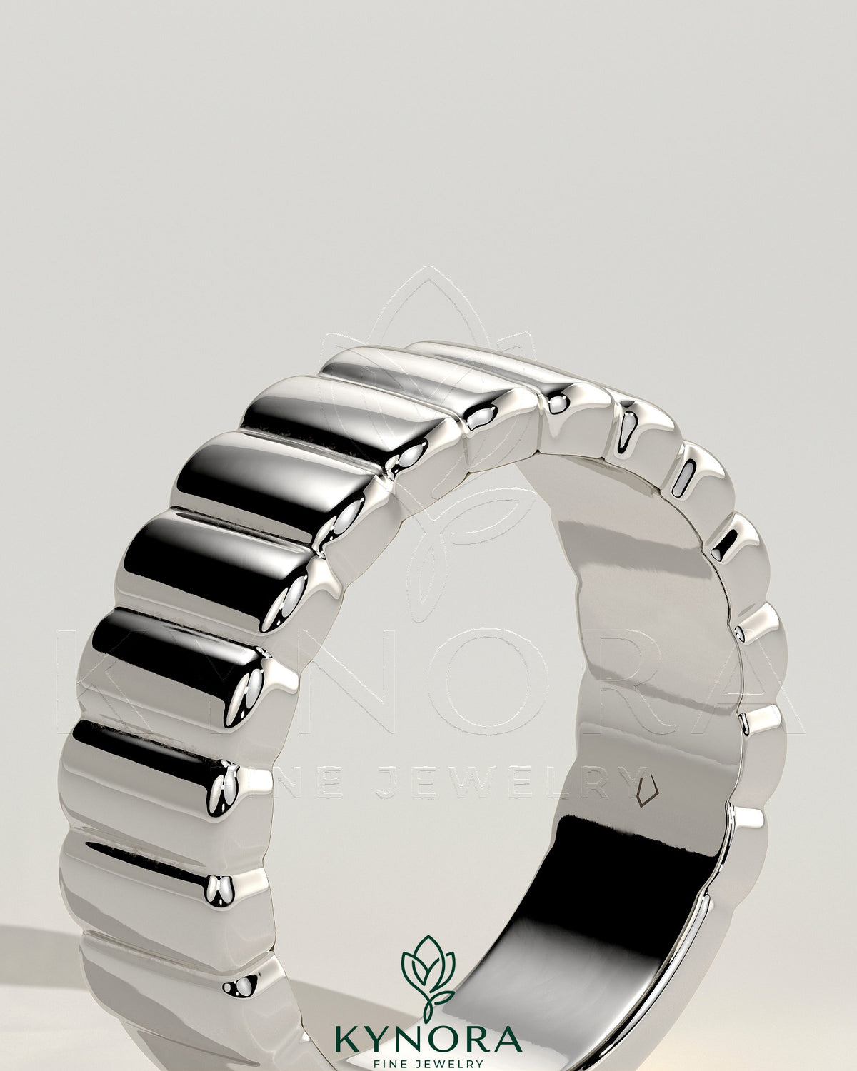 Kynora CJ fluted wedding band featuring a sleek, rounded cigar-style design in polished metal for a sophisticated look.