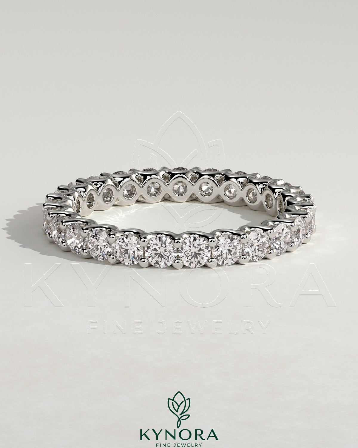 Kynora CJ full round eternity wedding band with scalloped setting in polished gold, showcasing intricate design and sparkling gemstones.
