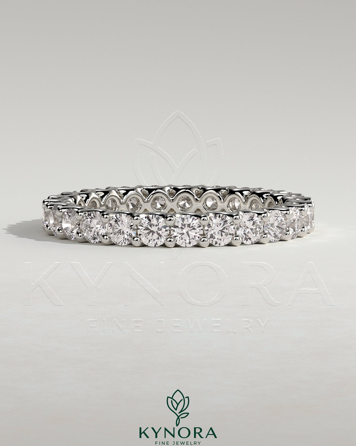 Kynora CJ full round eternity wedding band with scalloped setting, showcasing sparkling gemstones on a polished gold band.