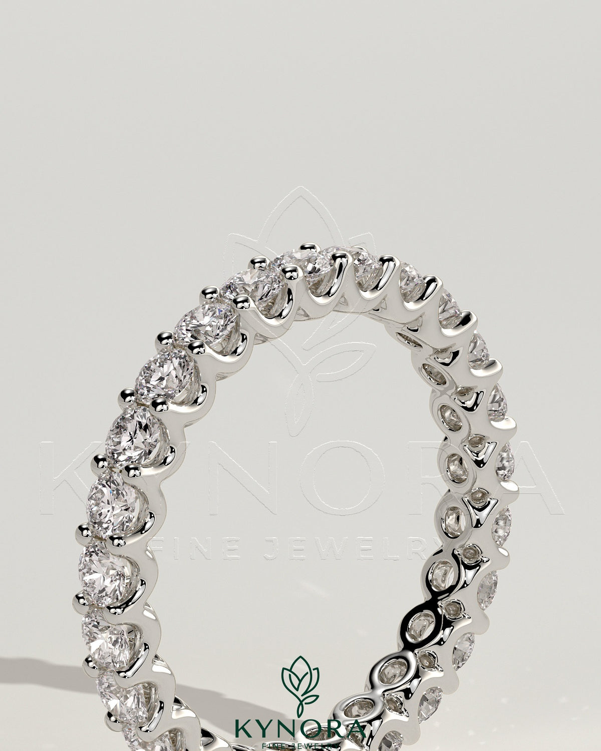 Full round eternity wedding band with scalloped setting by Kynora CJ, featuring a continuous circle of sparkling gemstones.