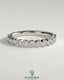 Kynora CJ half eternity round bezel set wedding band with sparkling gemstones, elegant and timeless jewelry for special occasions.